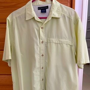 Men’s polyester shirt. Size L. Vented sides.